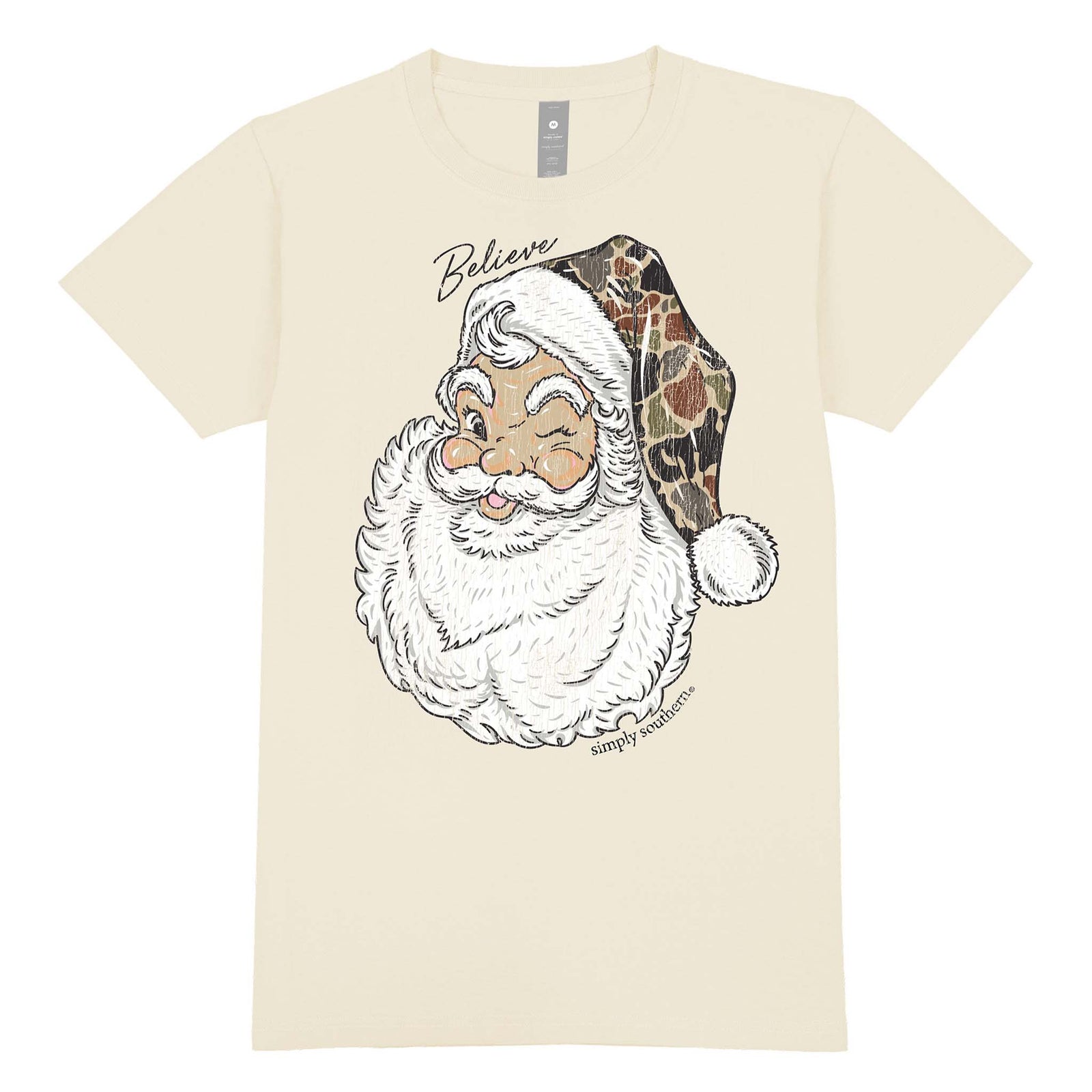 Beige t-shirt with a graphic of a Santa Claus face and 'Believe' text on a white background