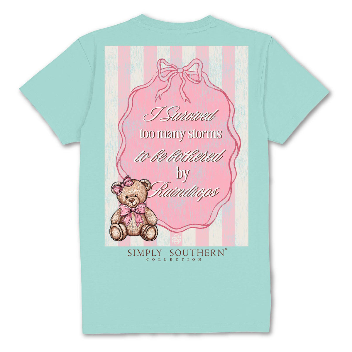 Back of mint green t-shirt with teddy bear, pink bow, and “I survived too many storms to be bothered by raindrops” text.