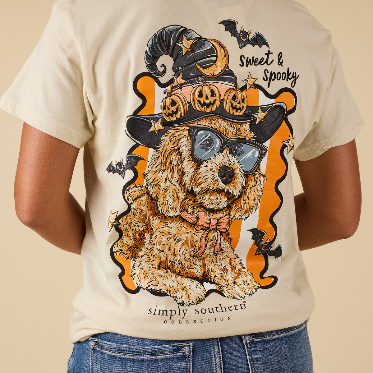 Back view of ivory Simply Southern tee with doodle dog Halloween design surrounded by stars and bats.