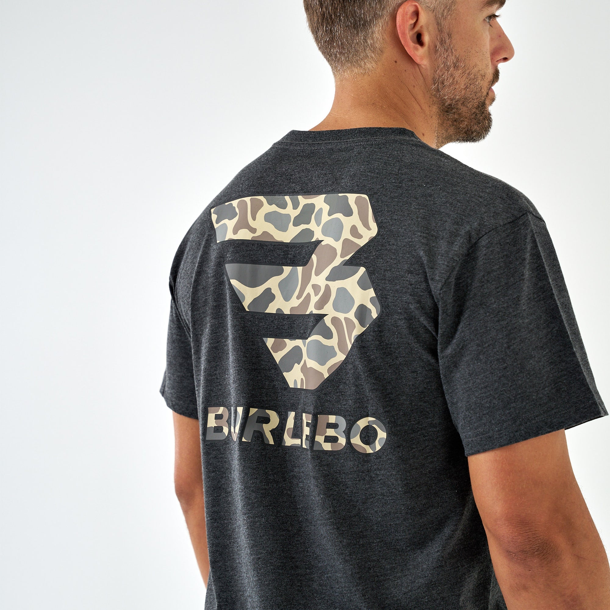 Back view of a dark charcoal short sleeve t-shirt with a large light brown camo Burlebo logo graphic.