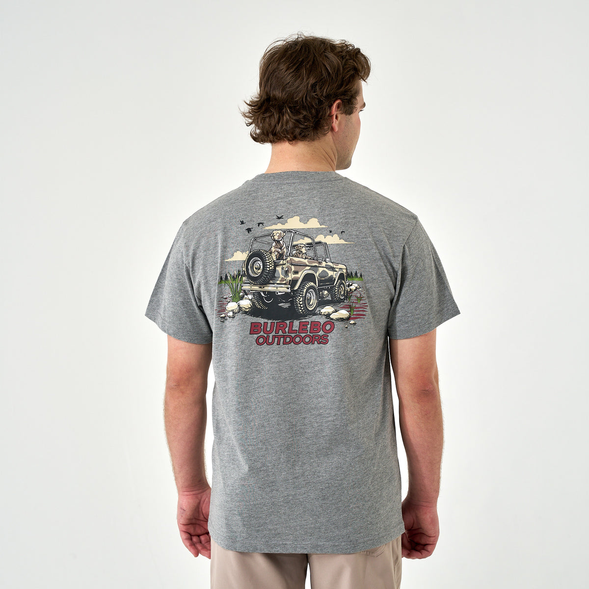 Back view of gray t-shirt with large jeep and dogs graphic, red “Burlebo Outdoors” text.