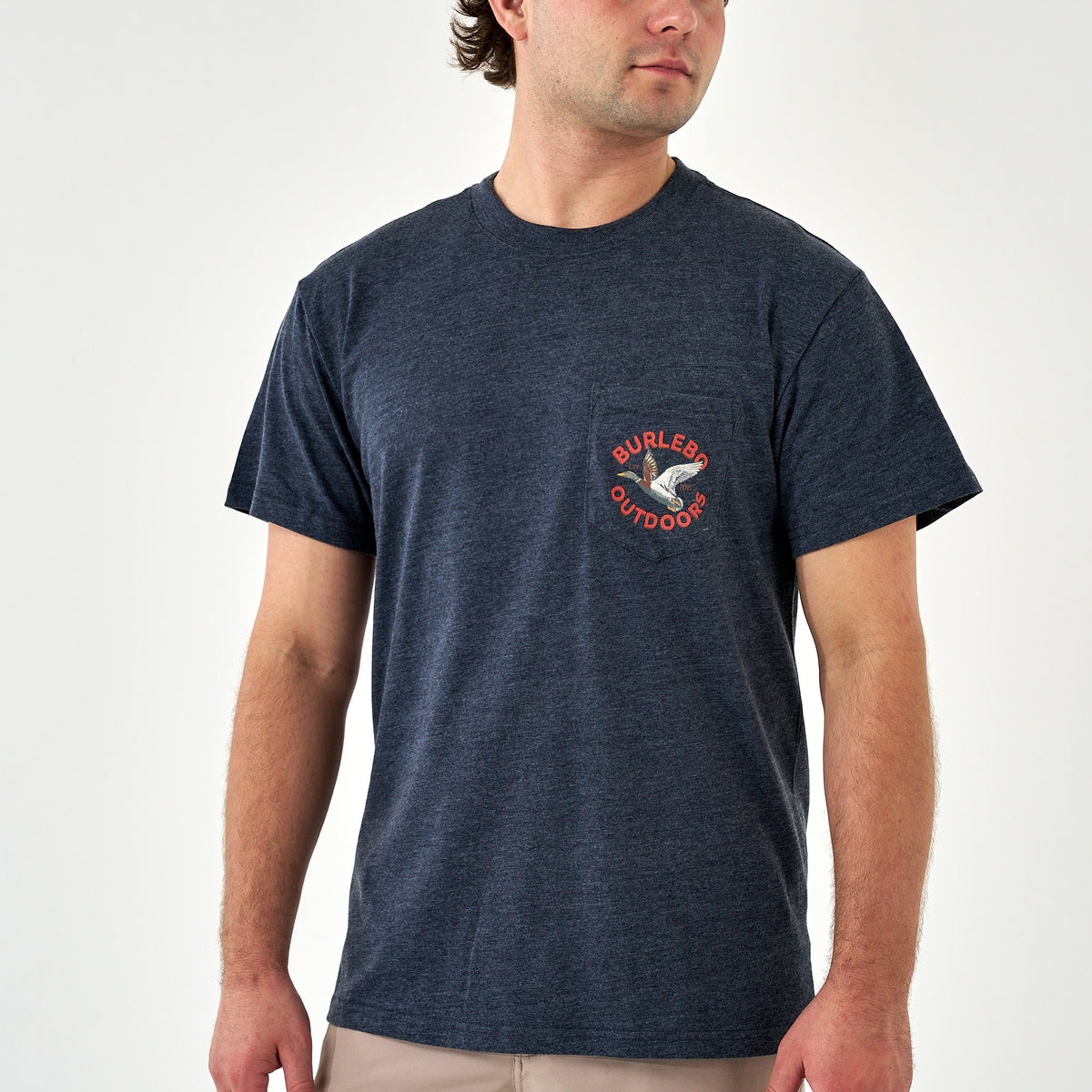 Man wearing navy Burlebo Outdoors t-shirt with small duck graphic and red text on left chest pocket.
