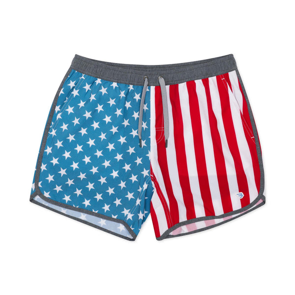 Burlebo Men's Swim Trunks in Throwback USA. Sizes S-XXL. Flat lay of swim trunks showing front design with blue star pattern, red and white stripes, grey waistband, and drawstring.