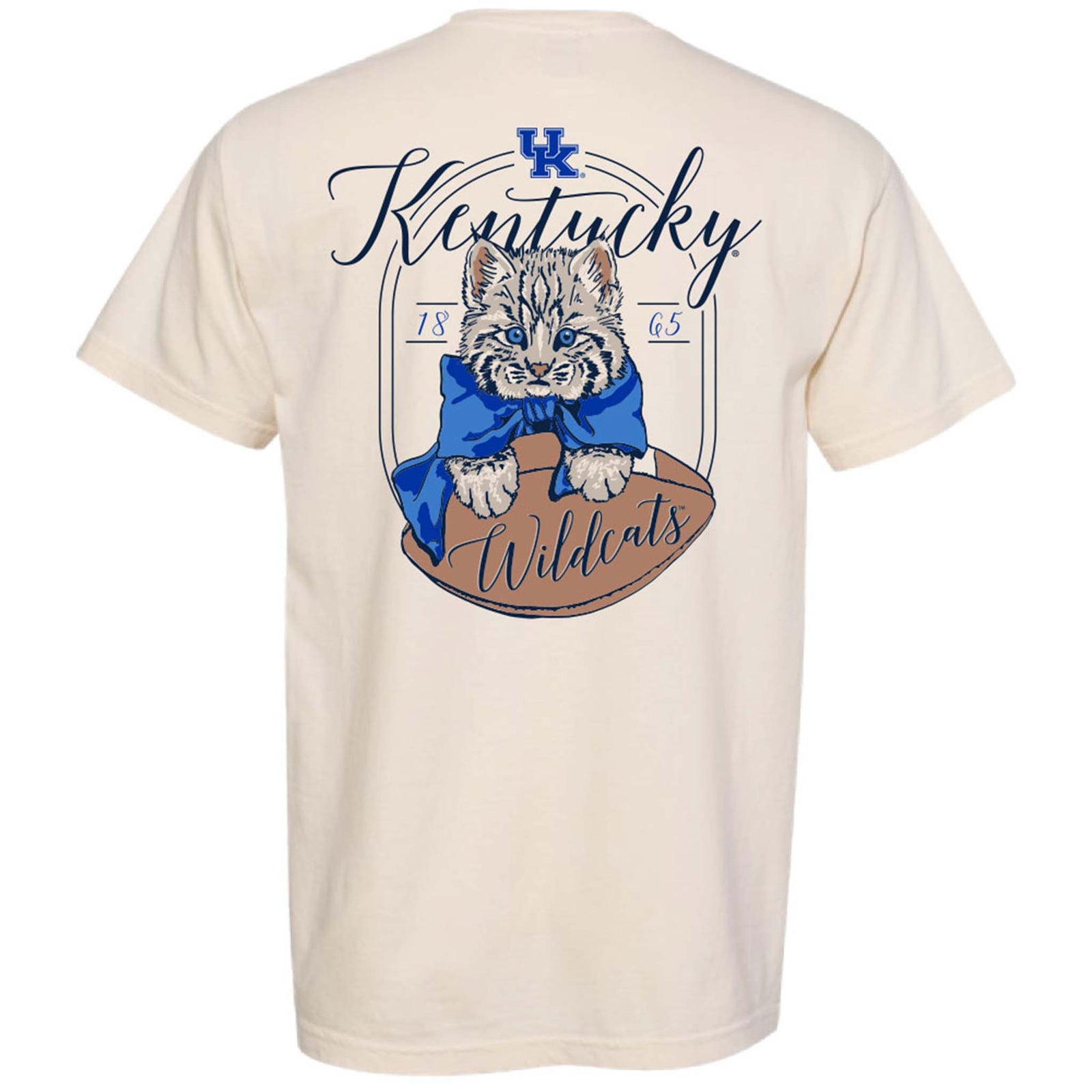 Ivory short-sleeve T-shirt featuring small Kentucky Wildcats logo on front left chest and back graphic of wildcat kitten with blue bow resting on a football with “Kentucky Wildcats” script.