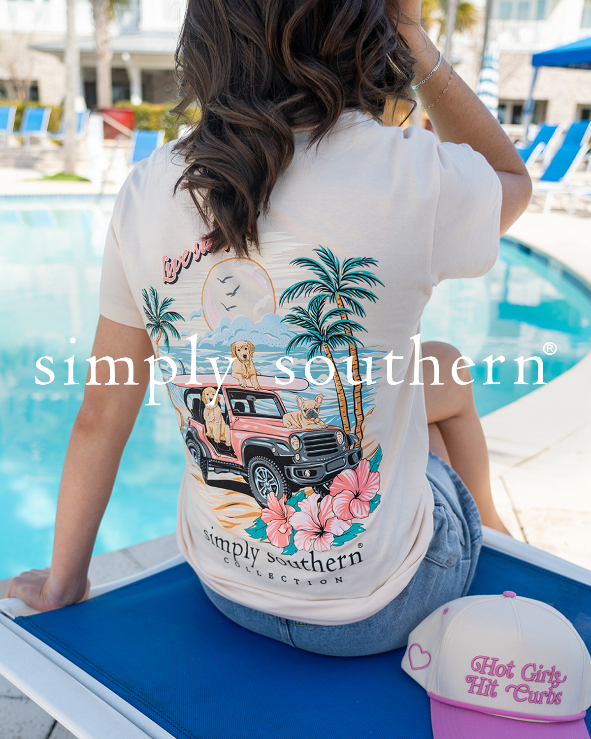 Woman sitting by a pool wearing a Simply Southern t-shirt.
