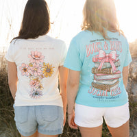 Two women standing on a beach wearing Simply Southern t-shirts.