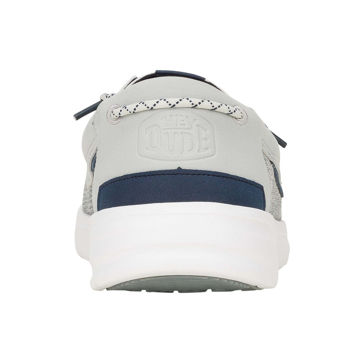 Gray and navy shoe with white sole on a white background