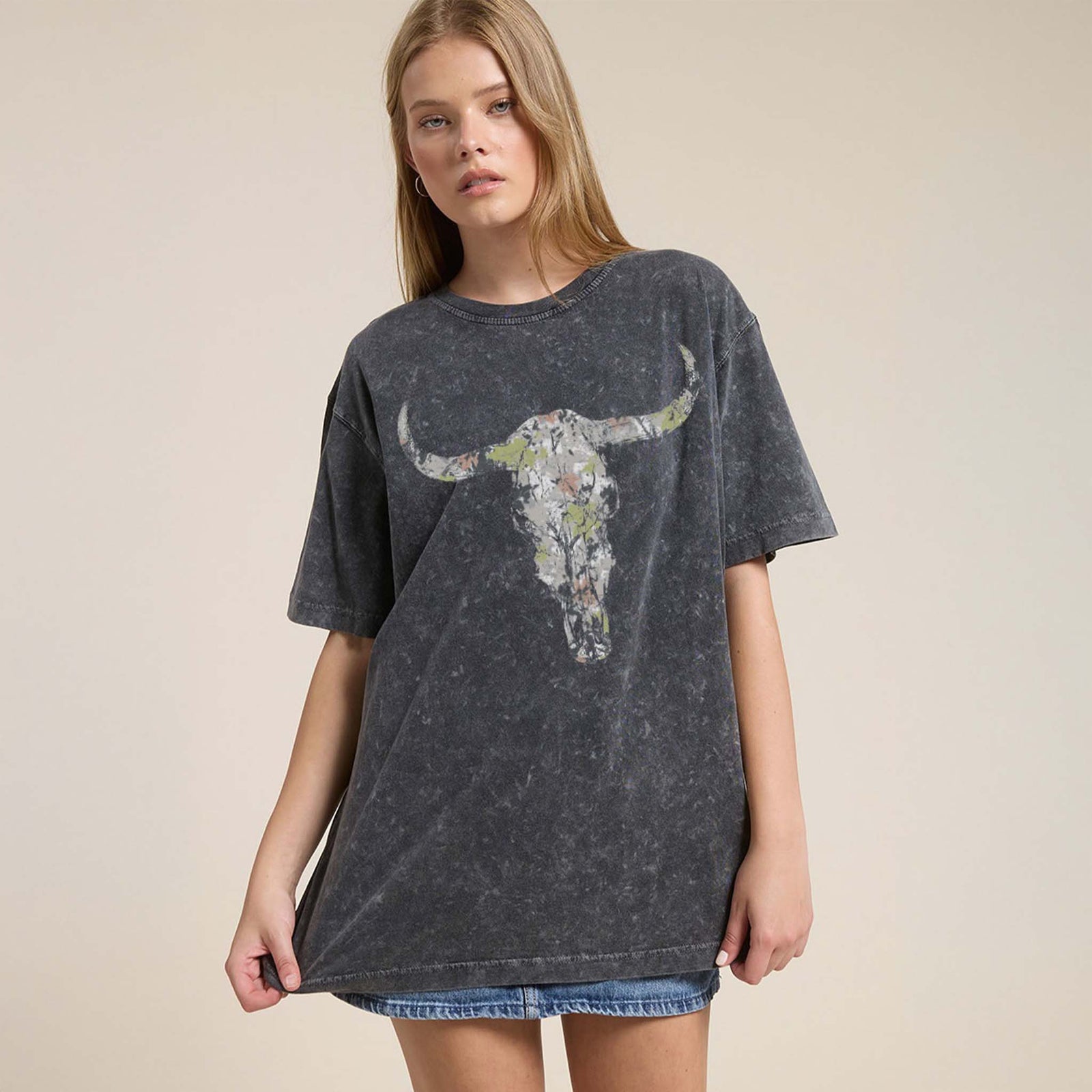 Black washed oversized tee with a distressed camo longhorn skull on the front and large white Western text reading 'YEE ★ HAW' across the back.