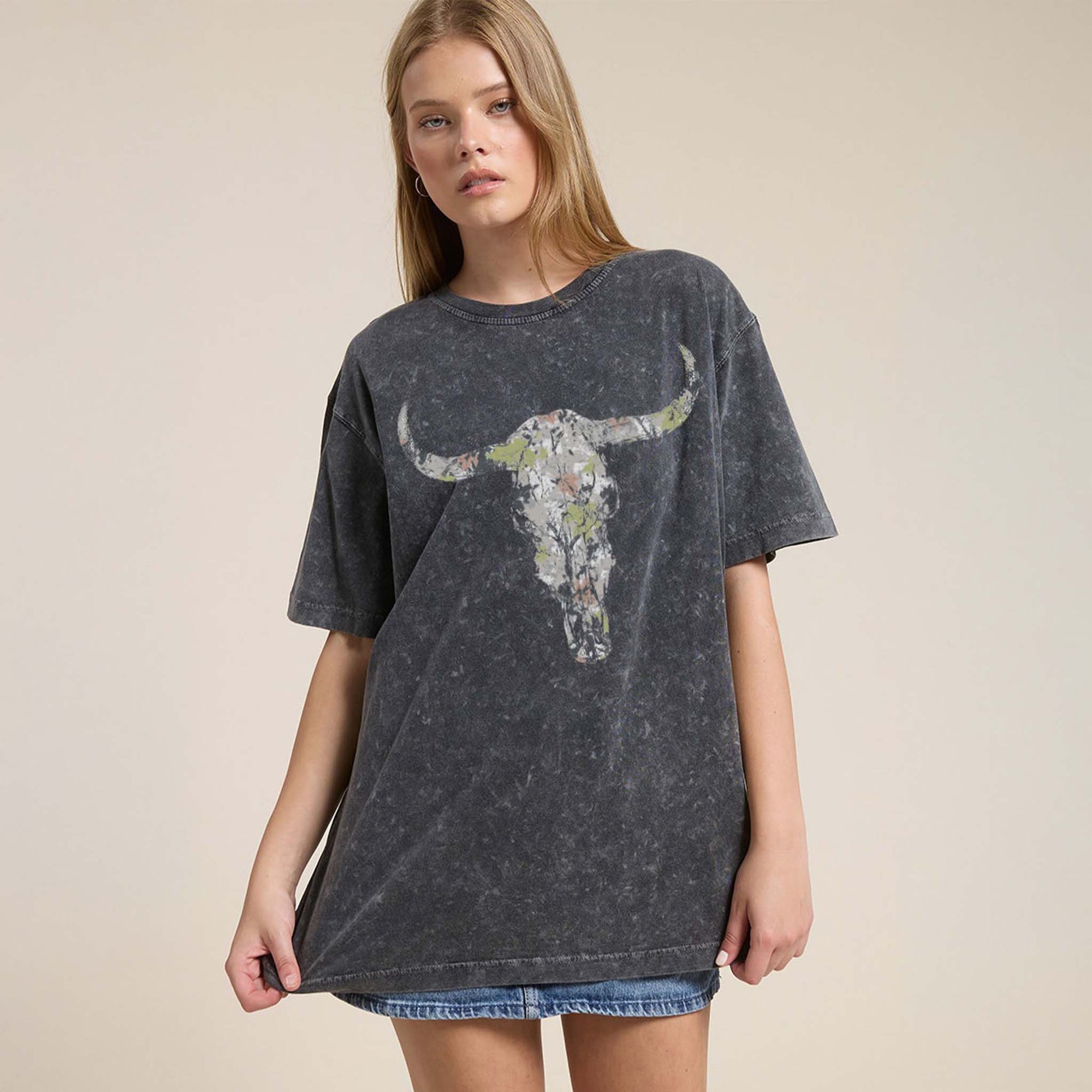 Black washed oversized tee with a distressed camo longhorn skull on the front and large white Western text reading 'YEE ★ HAW' across the back.