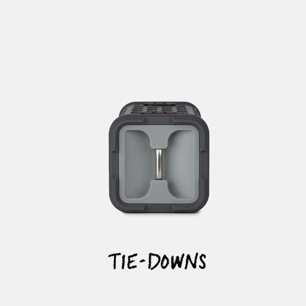 Tie-down end of the gray Turtlebox Ranger speaker featuring a metal bar inside a recessed square frame for secure attachment.