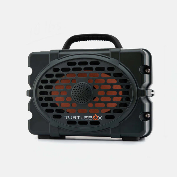 Turtlebox Gen 3 Green Portable Speaker shown from the front with a rugged green shell, speaker grille, and black carry handle on top.