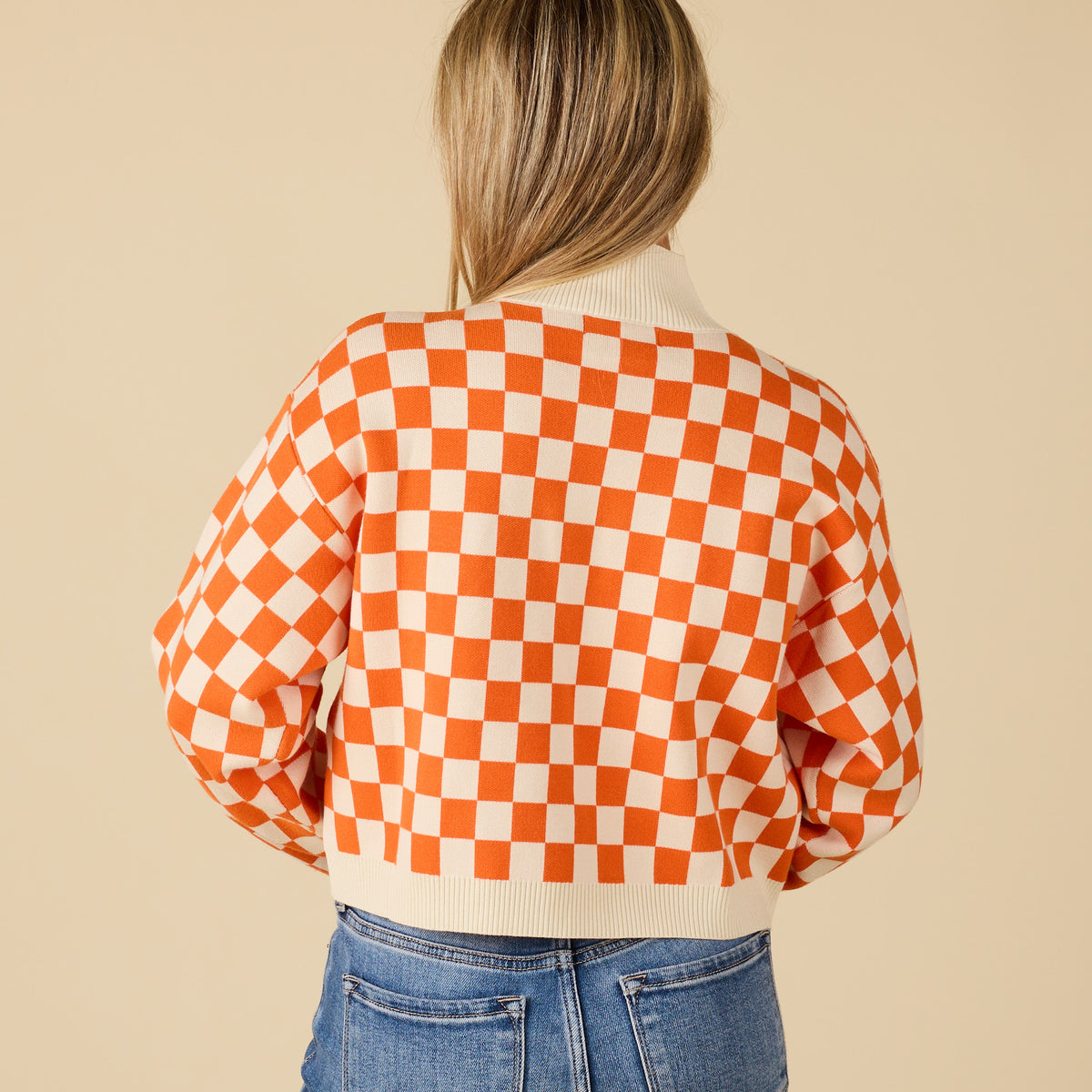 Back view of Tennessee Volunteers orange and white checkered sweater with ribbed hem and cuffs.