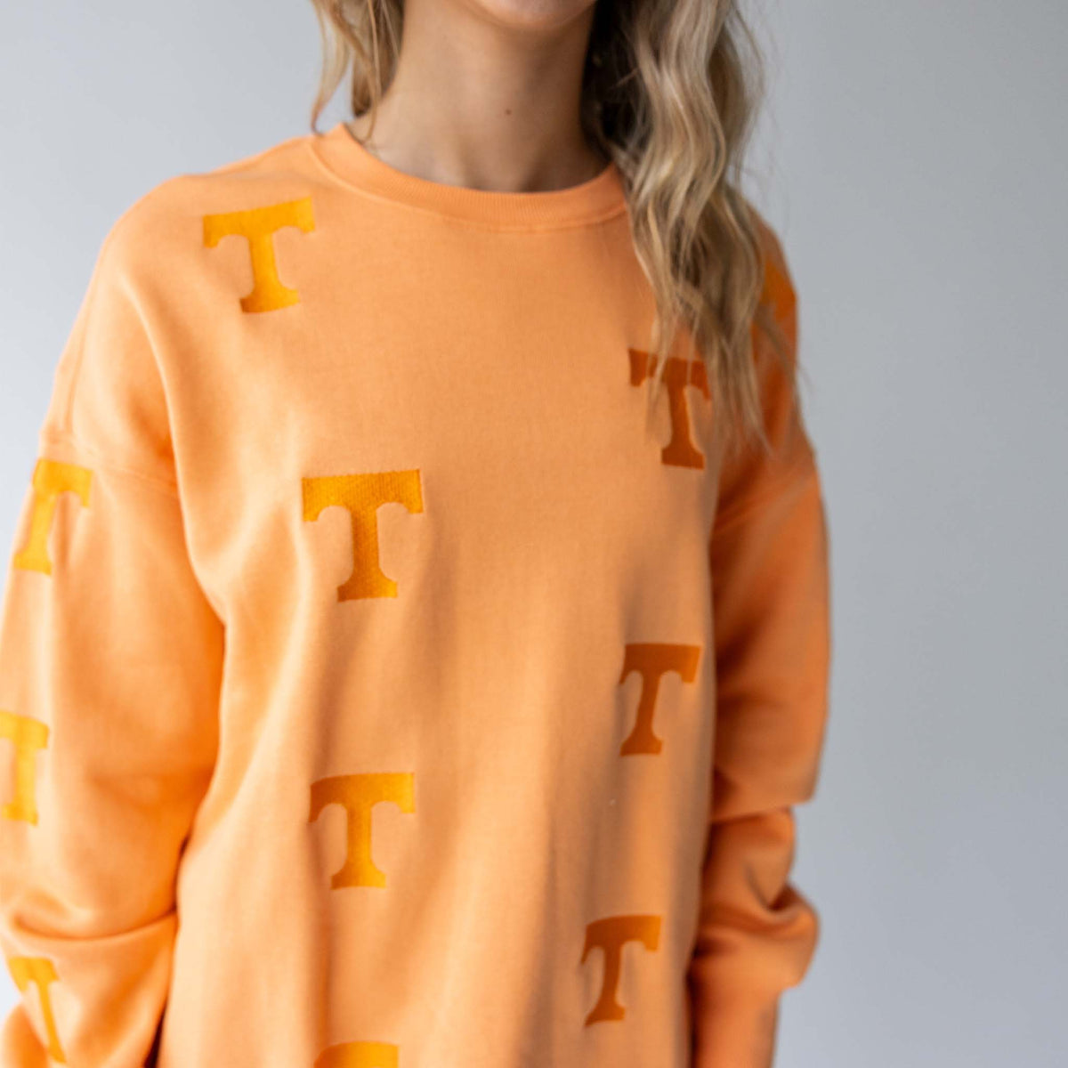 Close-up front view of Tennessee Volunteers crewneck showing tonal "T" pattern design.