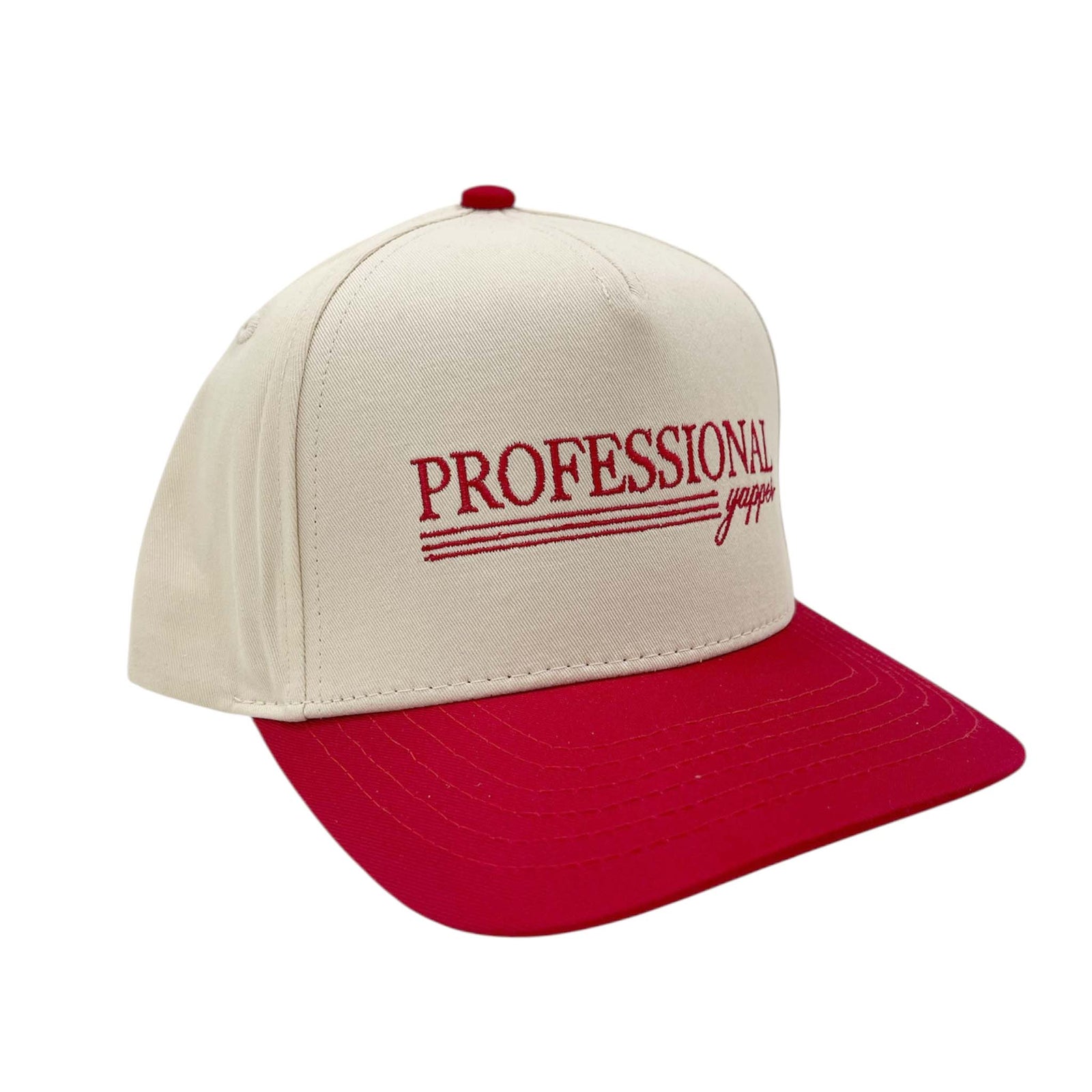 The Happiest Professional Yapper Hat
Beige and red baseball cap with a structured crown and curved brim; features red embroidered text on the front that reads “PROFESSIONAL yapper” with two red underline lines beneath “PROFESSIONAL.”