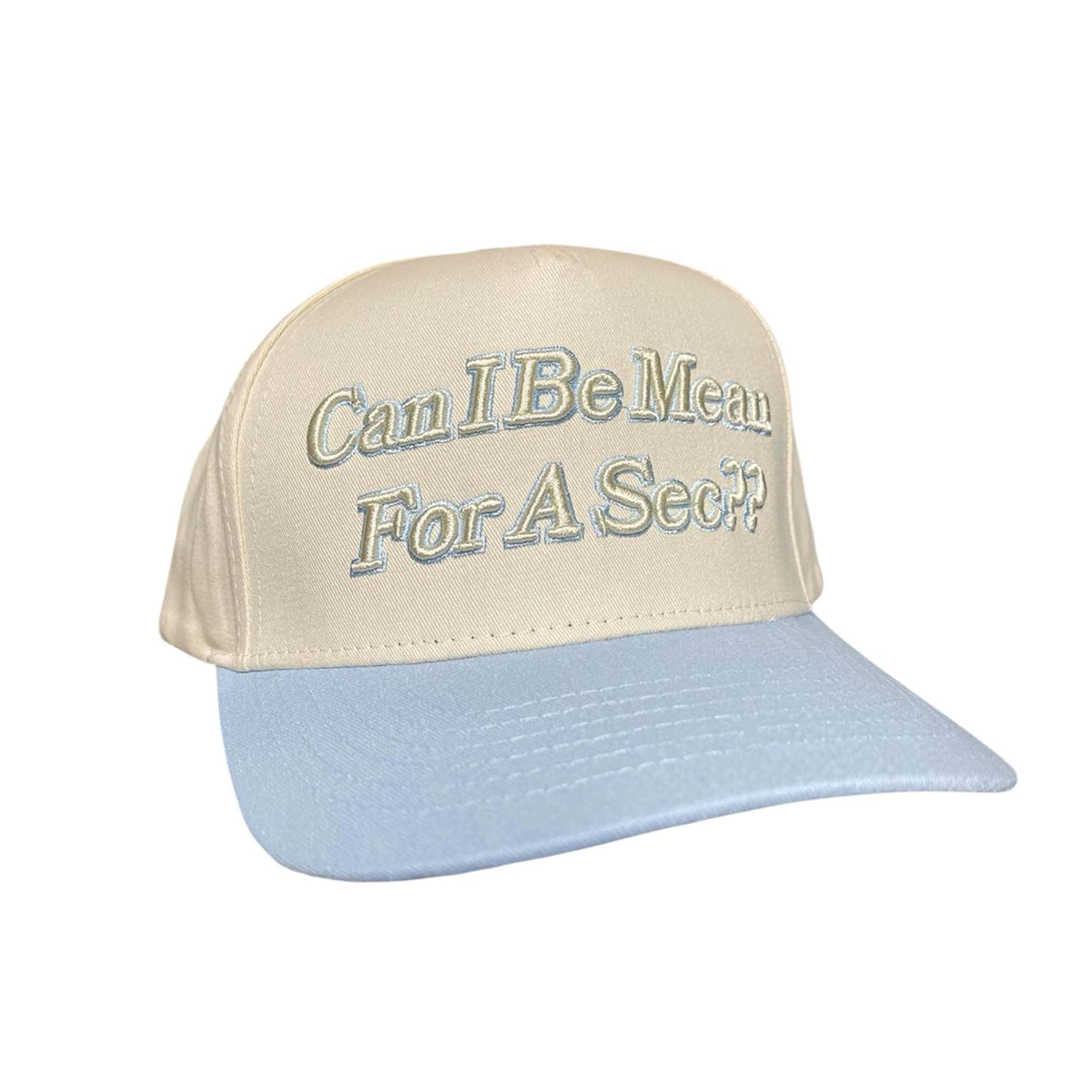 Cream and light blue trucker hat with raised embroidered text reading “Can I Be Mean For A Sec??” on the front panel.
