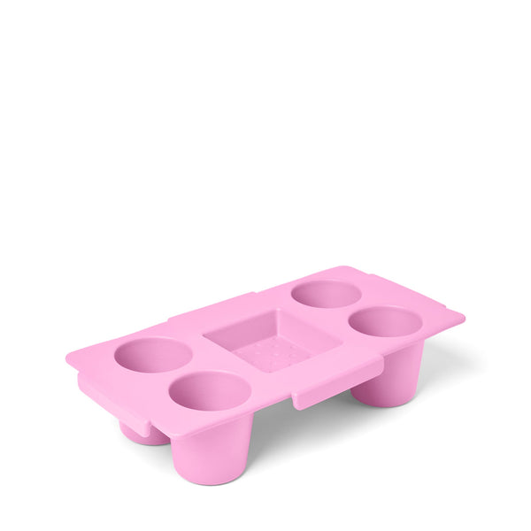 Pink plastic tray with multiple openings shown on a white background