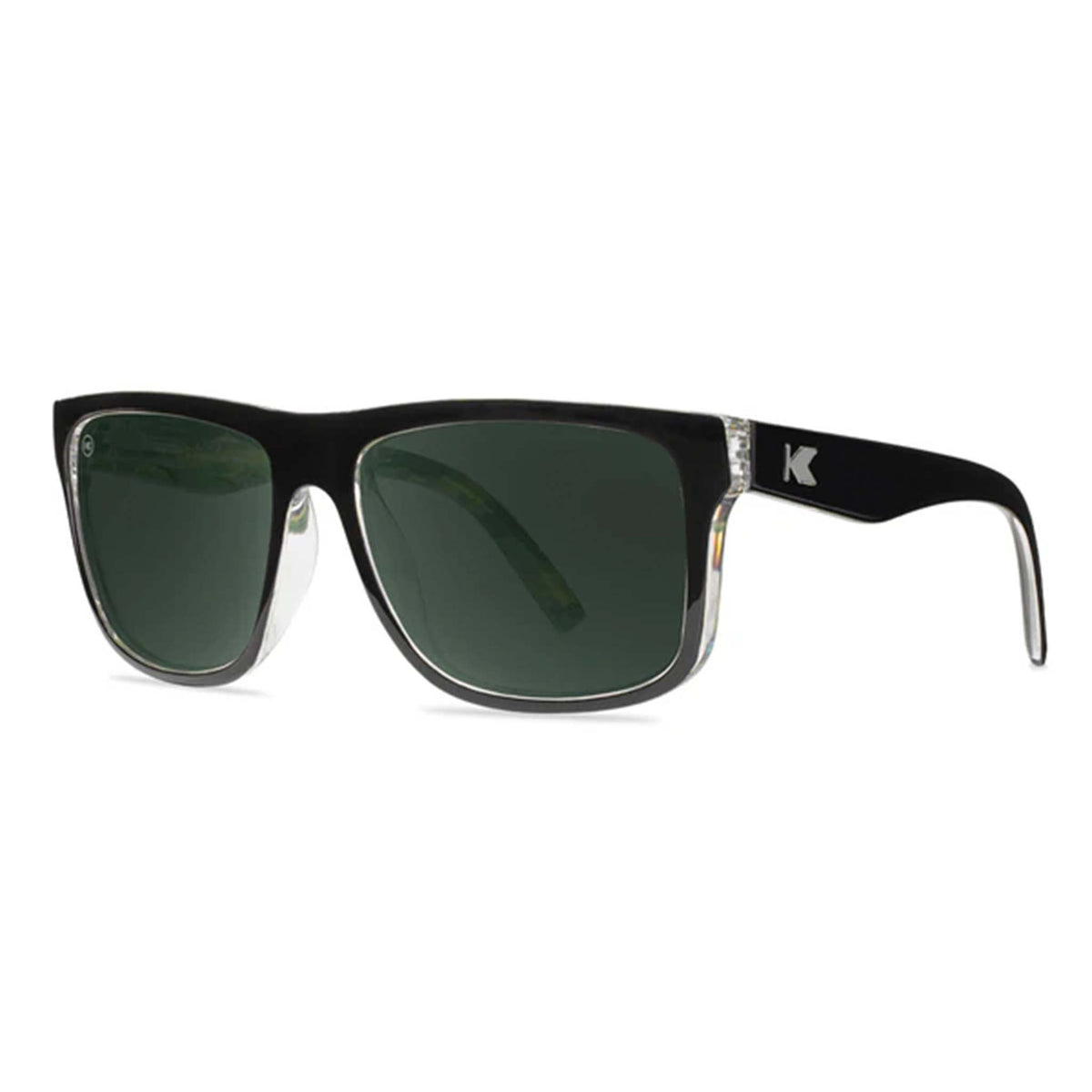 Black sunglasses with green lenses on a white background