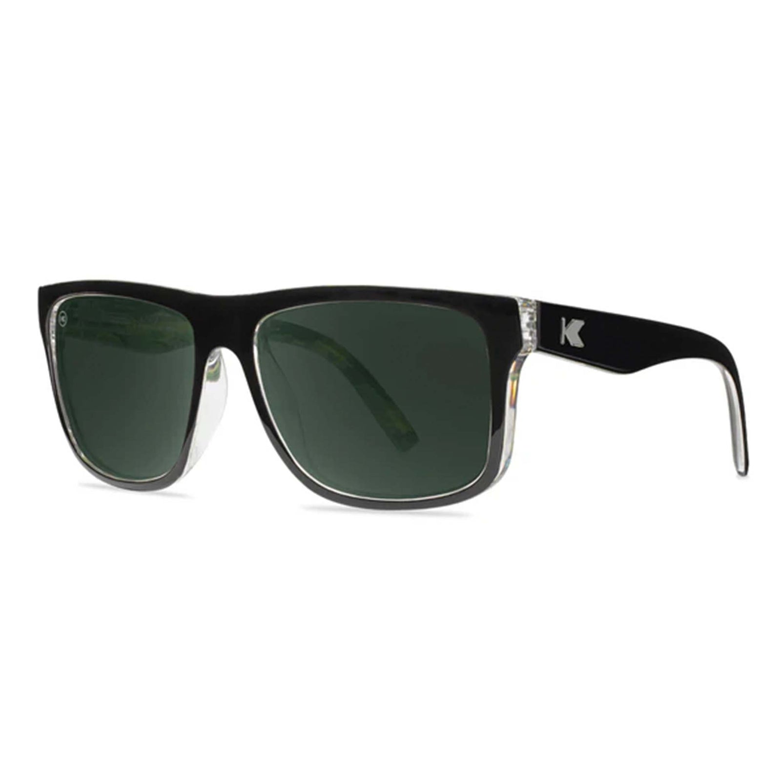 Black sunglasses with green lenses on a white background