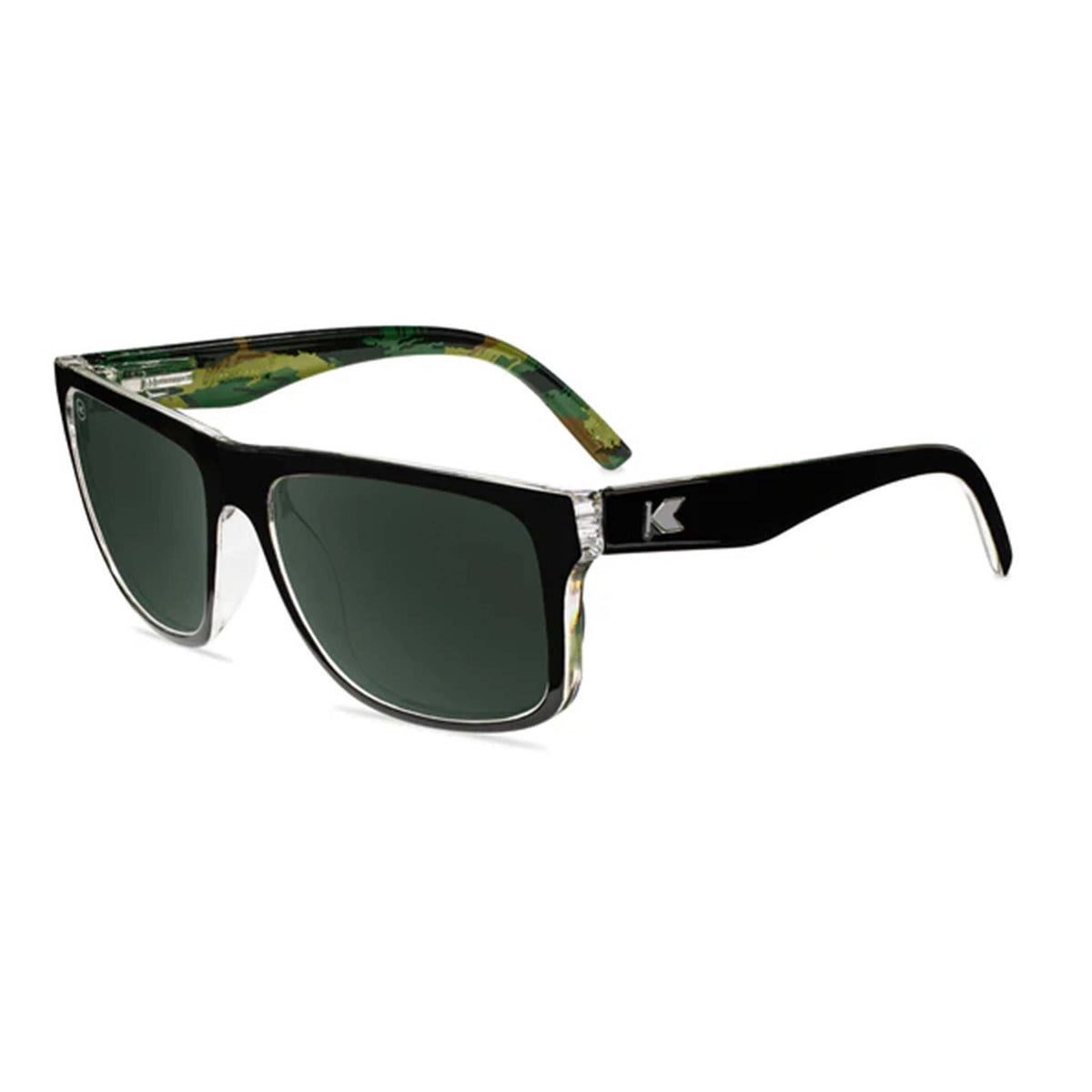 Sunglasses with black frame and green-tinted lenses on a white background
