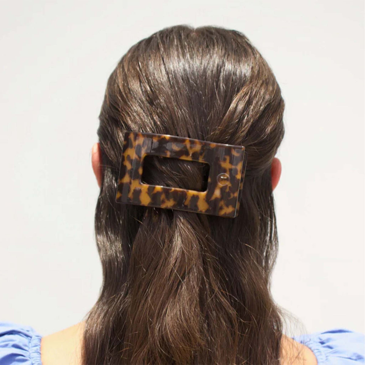 Medium Flat Rectangle Hair Clip in Tortoise securing half-up hairstyle.