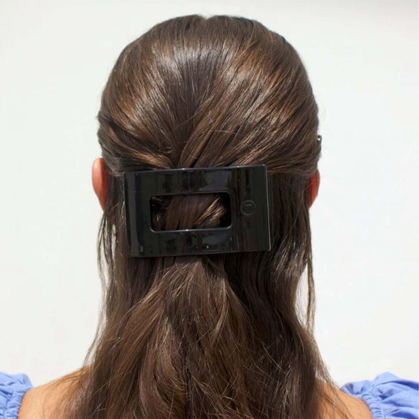 Medium Flat Rectangle Hair Clip in Jet Black securing half-up hairstyle.
