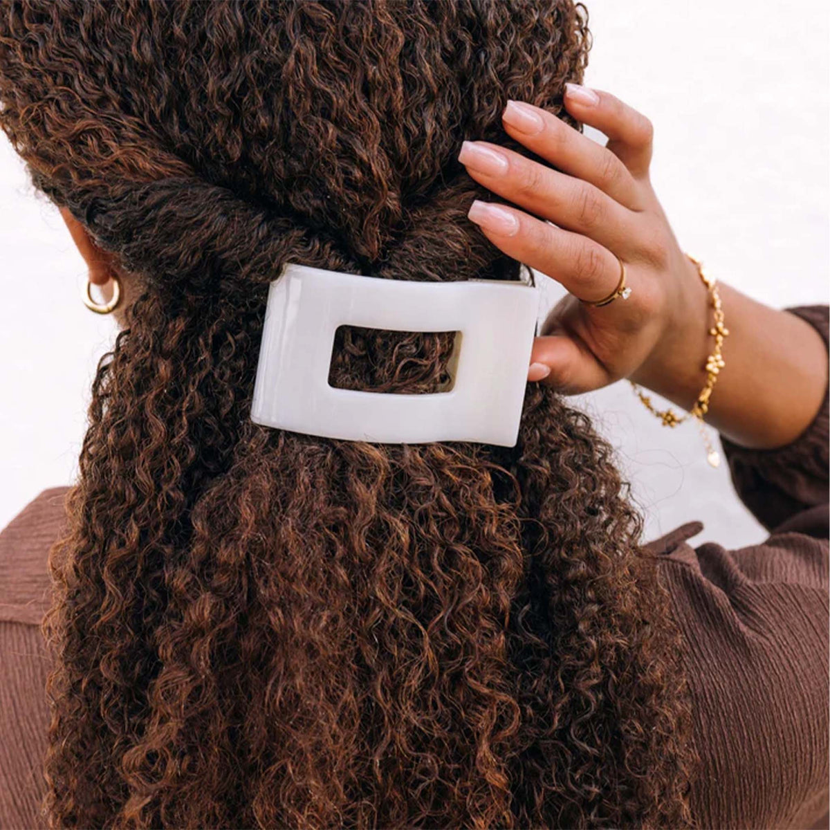 Medium Flat Rectangle Hair Clip in  coconut white securing half-up hairstyle.