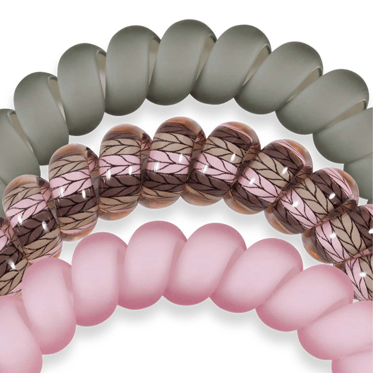 Close-up of three Teleties Large Hair Ties in Sage It Ain’t So showing matte sage, pink, and leaf-patterned designs.