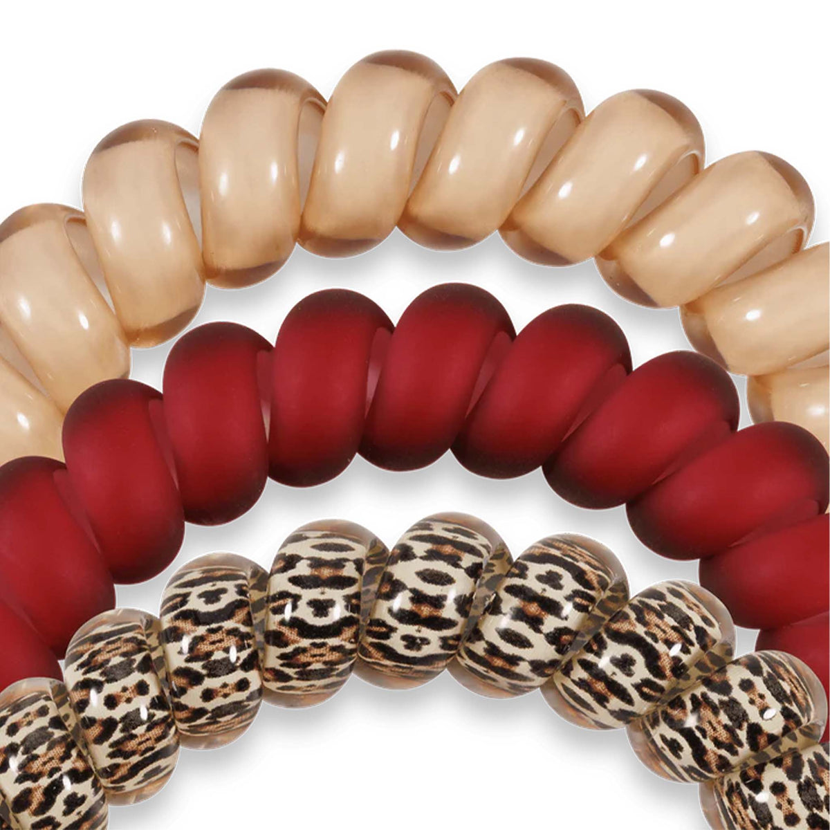 Close-up of Teleties Large Hair Ties in Wild Side showing glossy beige, matte red, and leopard print designs.