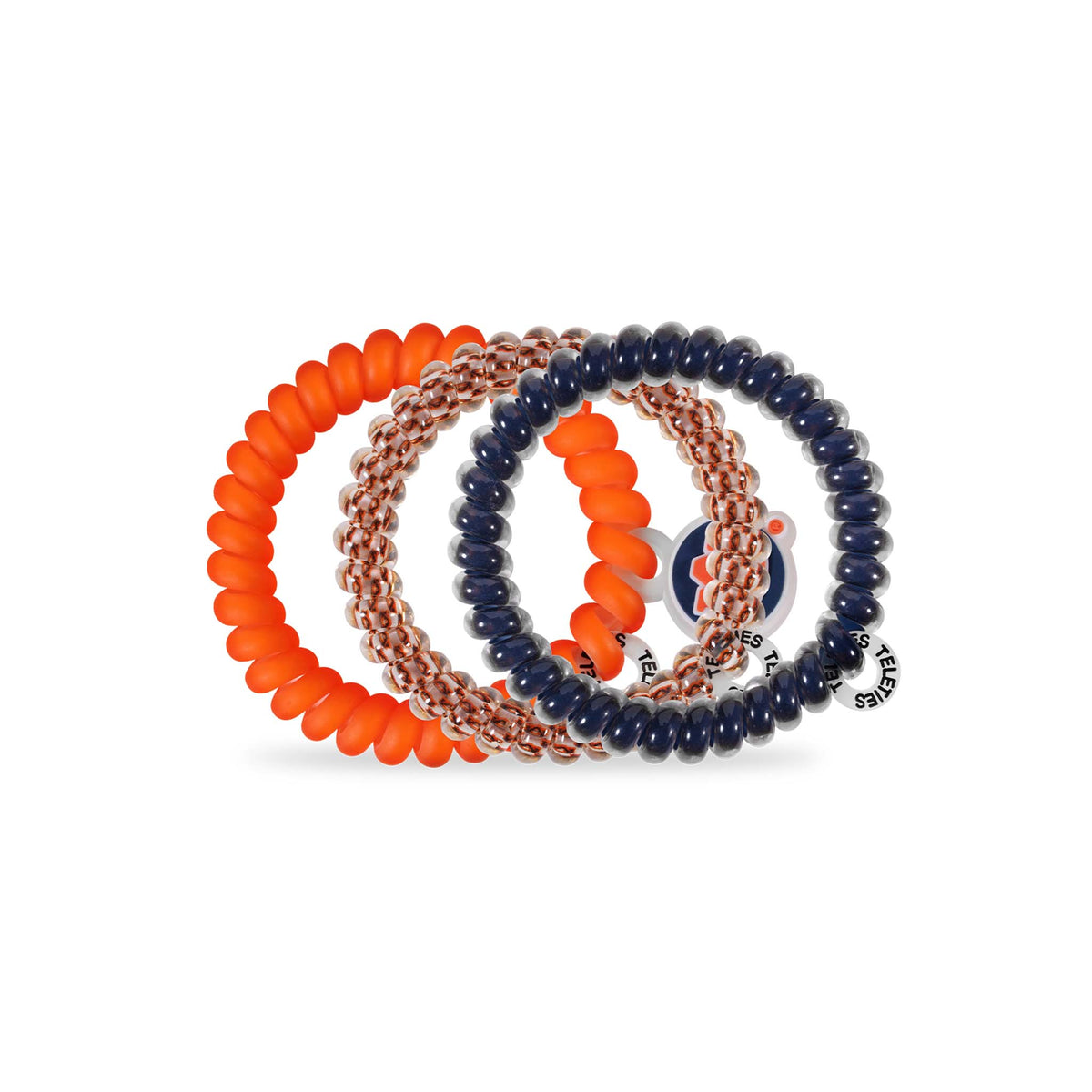 Auburn Teleties three-pack showing spiral hair ties in orange, patterned clear and orange, and navy blue with round tag.