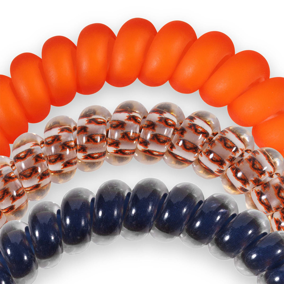 Auburn Teleties three-pack with spiral hair ties in solid orange, clear with orange pattern, and solid navy.