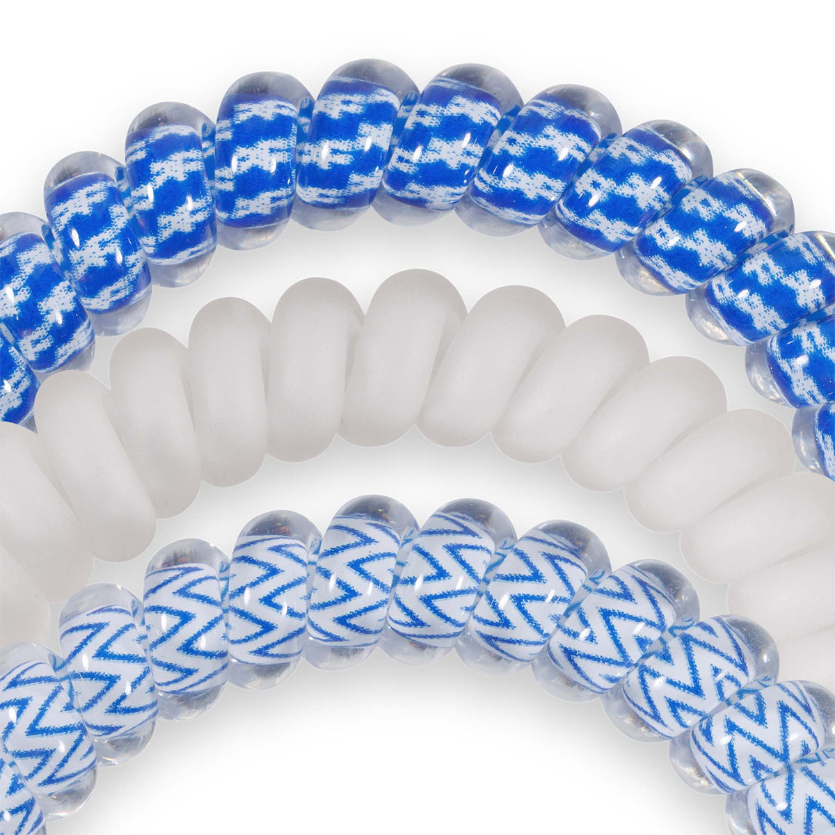 Kentucky Teleties set with spiral hair ties in blue houndstooth pattern, solid white, and clear with blue zigzag design.