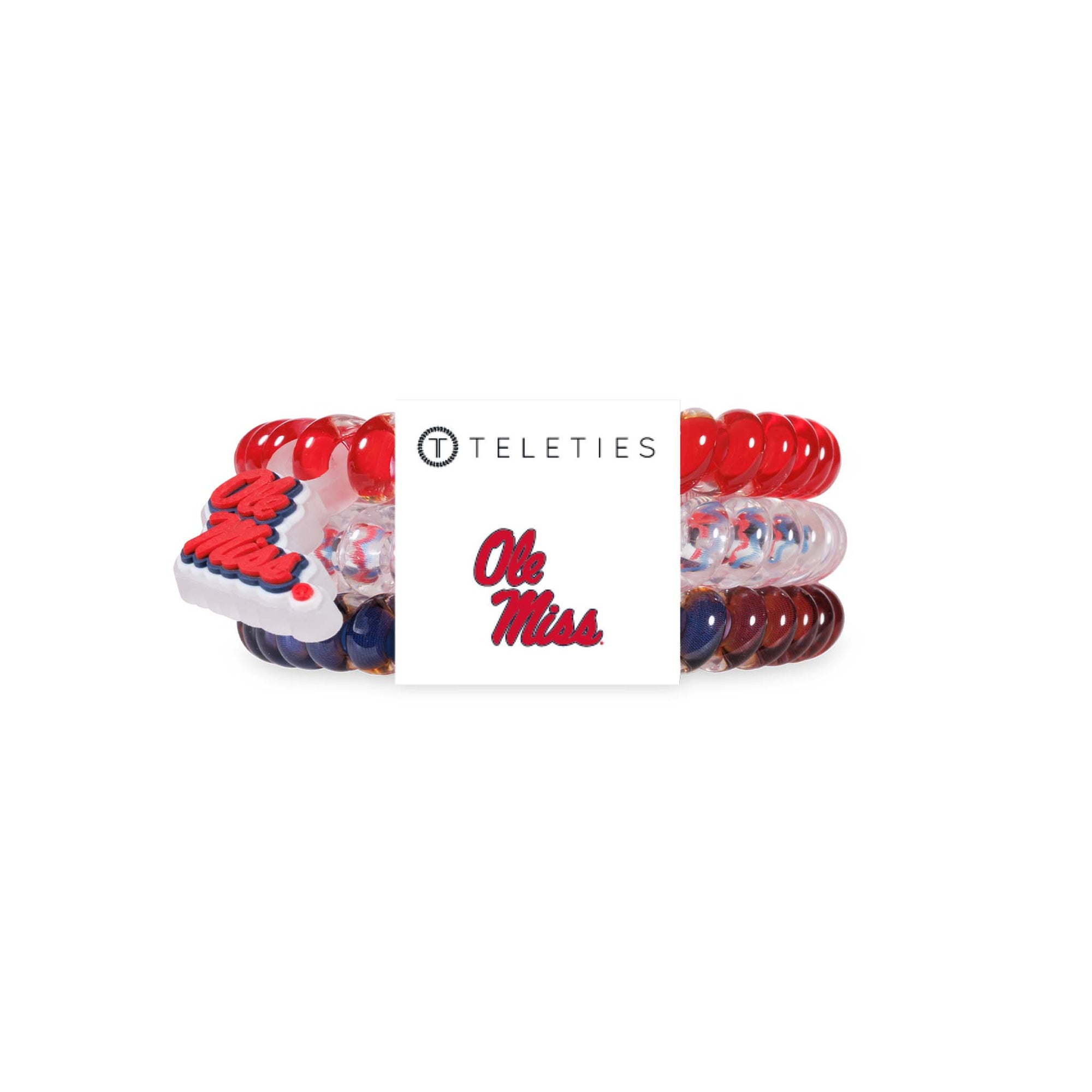Ole Miss Teleties three-pack featuring spiral hair ties in solid red, clear with red and blue pattern, and solid navy with Ole Miss logo packaging.