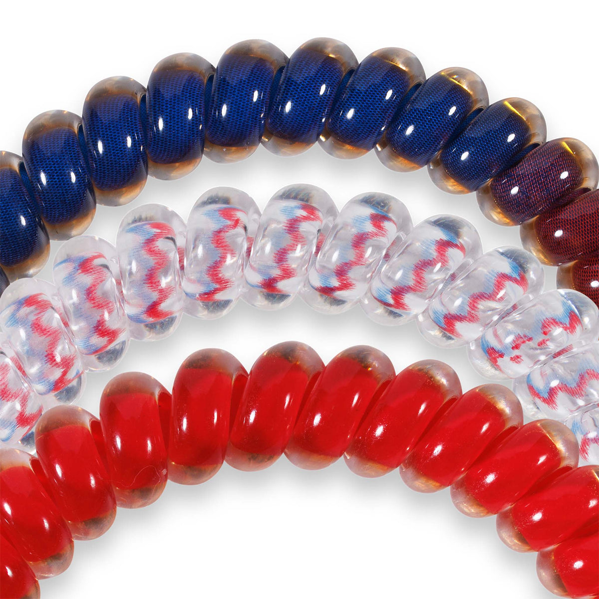 Ole Miss Teleties three-pack showing hair ties in red, patterned clear, and navy, displayed with round logo tag and Ole Miss charm.