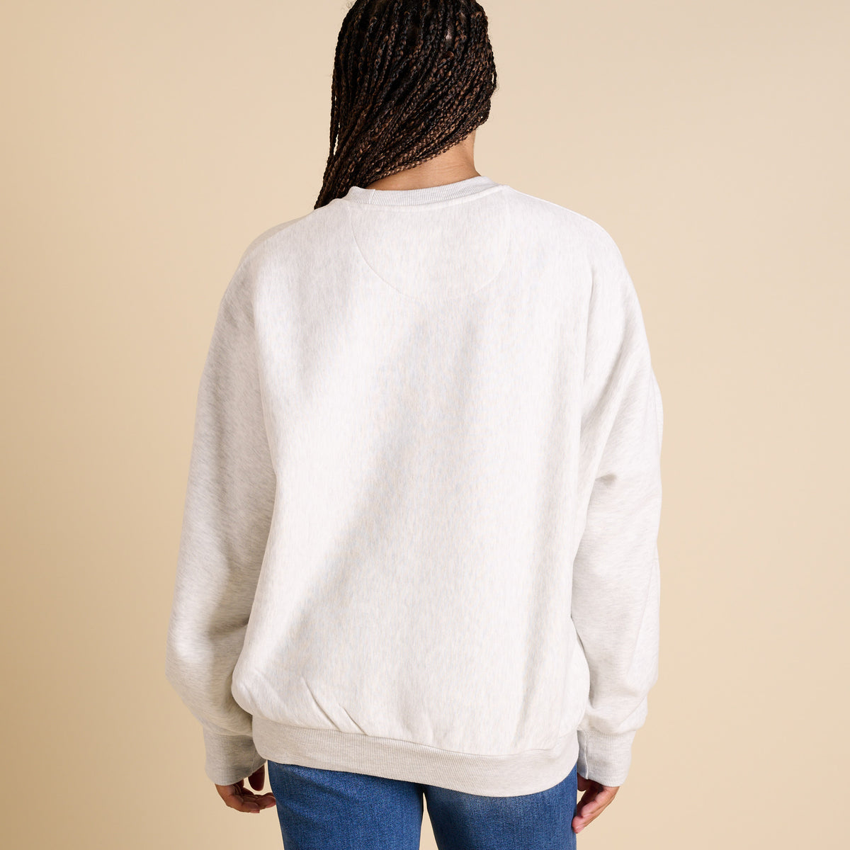 Back view of oversized ash gray UNC Tar Heels crewneck sweatshirt with plain design.