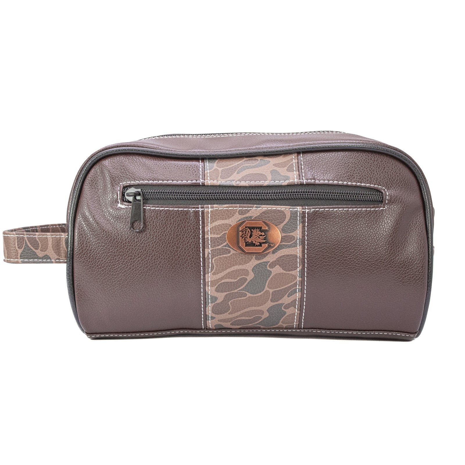 Leather dopp kit with a rich brown finish, featuring a silver concho-style USC emblem centered on the front. The bag is rectangular with a top zipper closure and a side leather handle, displayed against a plain, neutral background.