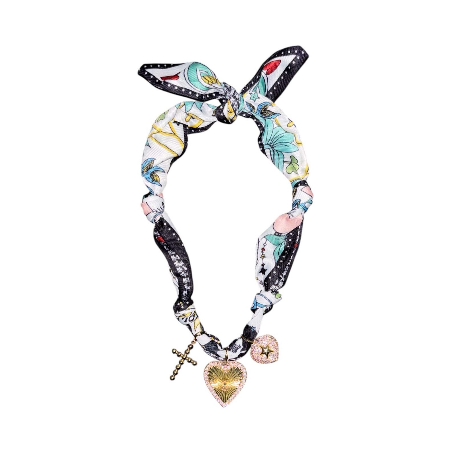 Multicolor knotted fabric necklace with gold-tone cross, rhinestone heart charm, and glitter heart charm with star accent.