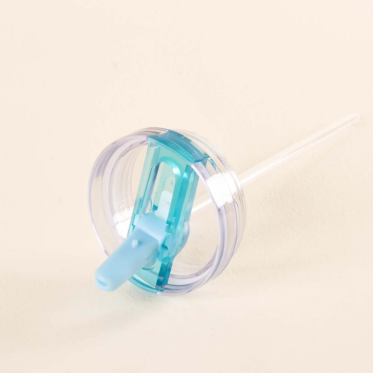 Flip straw lid with clear straw inserted, featuring a blue silicone spout and transparent round lid.