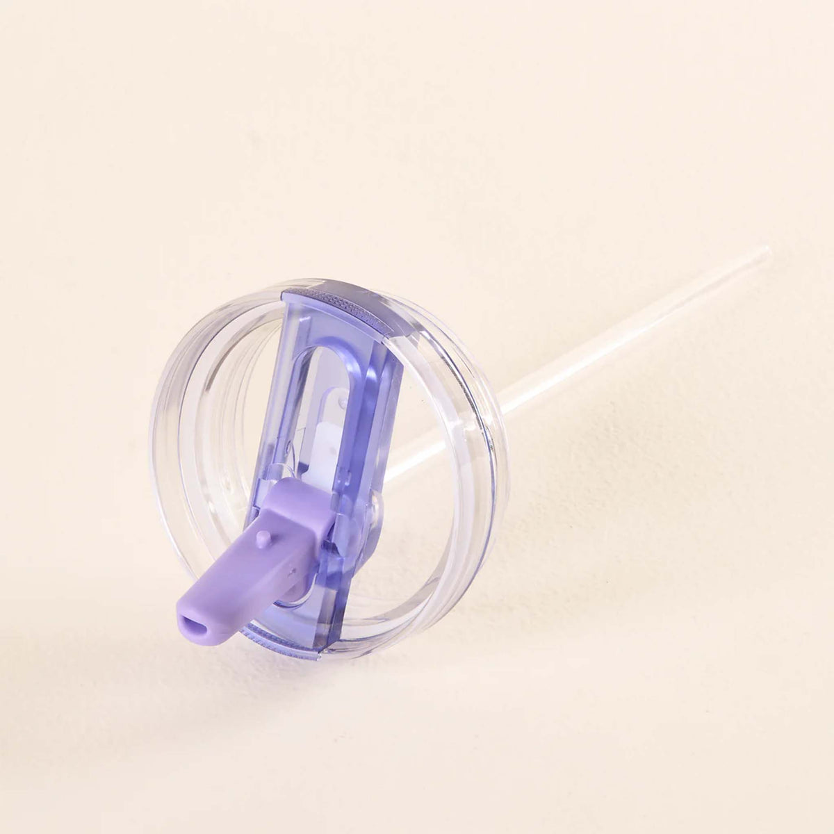 Side view of periwinkle purple flip straw lid with attached clear straw on a neutral background.