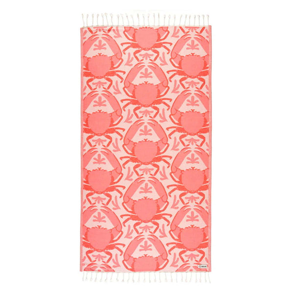 Sand Cloud Beach towel with peach crab pattern on a white background