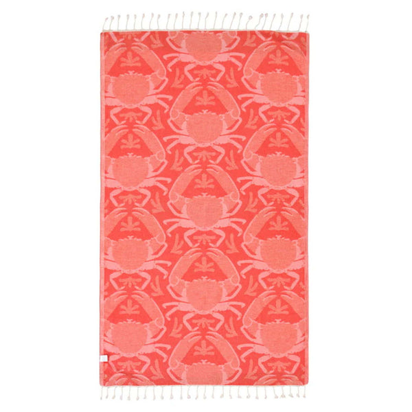Sand Cloud Beach towel with peach crab pattern on a white background