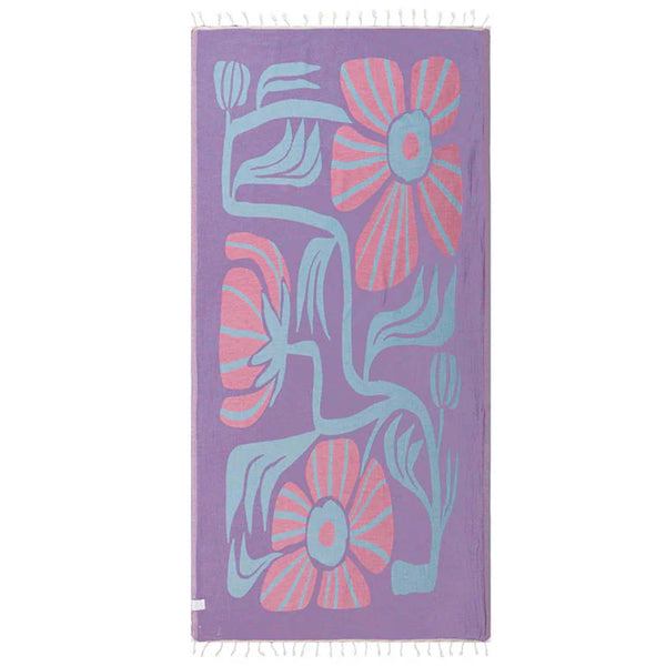 Purple Sand Cloud towel with pink flowers and blue leaves pattern on a white background