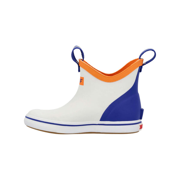 Side view of XTRATUF Youth Blue Ankle Deck Boot in White, highlighting the blue stretch-fit ankle, easy pull tab, and slip-resistant white outsole.
