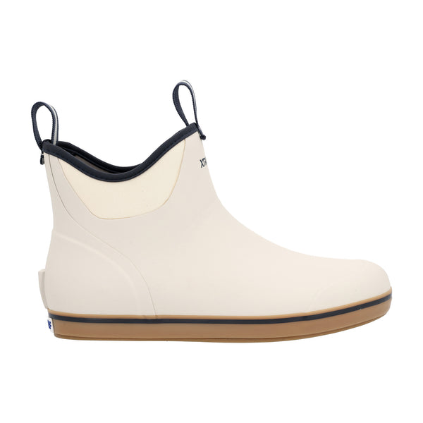Side view of the boot highlighting the Navy XTRATUF logo on the ankle, pull-tab at the heel, and contrasting beige sole against the Ivory upper.