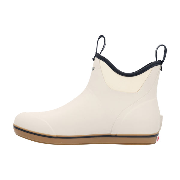 Side view of the boot highlighting the Navy XTRATUF logo on the ankle, pull-tab at the heel, and contrasting beige sole against the Ivory upper.