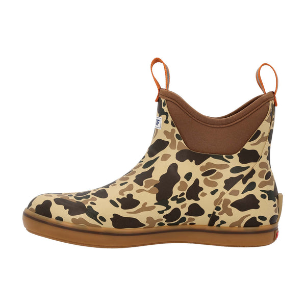 Camouflage-patterned boot with brown accents on a white background
