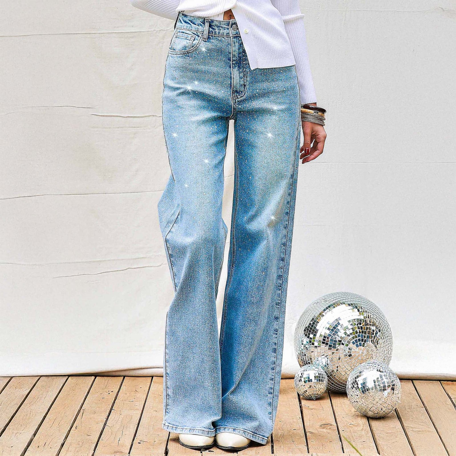 Woman wearing Vibrant Miu Rhinestone Straight Leg Light Wash Jeans 