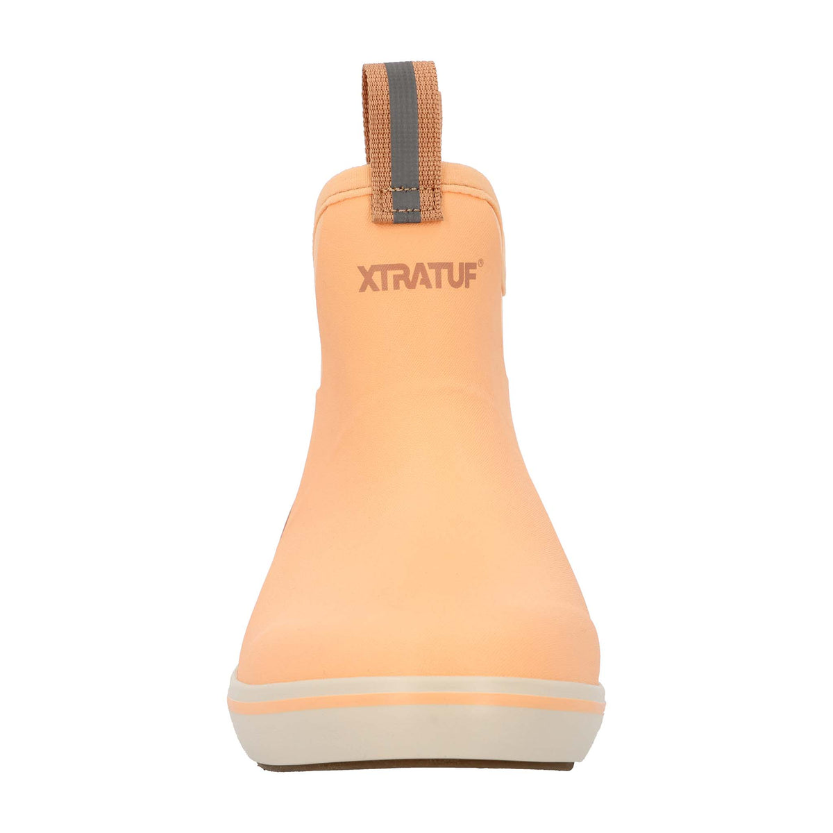 Peach slip-on boot with brown accents on a white background