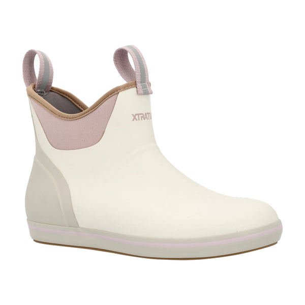 Women’s 6-inch waterproof ankle deck boot in solid Ivory with a rounded toe, reinforced rubber upper, and slip-resistant outsole; features front and back pull-tabs for easy on and off, a cushioned insole for comfort, and a non-marking sole designed for wet surfaces.