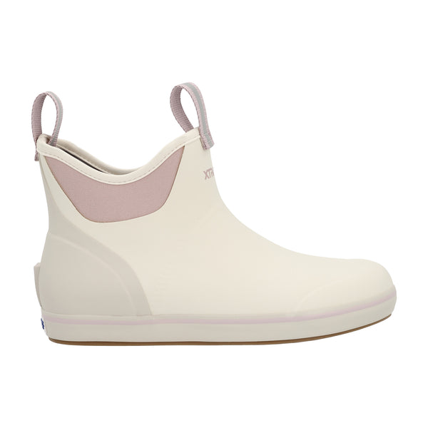 Women’s 6-inch waterproof ankle deck boot in solid Ivory with a rounded toe, reinforced rubber upper, and slip-resistant outsole; features front and back pull-tabs for easy on and off, a cushioned insole for comfort, and a non-marking sole designed for wet surfaces.