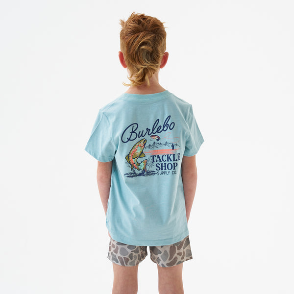 Child wearing Burlebo Youth Tackle Shop Short Sleeve T-Shirt in Sky Blue in front of a white backdrop.